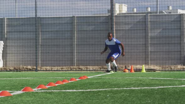 Soccer player training on field alt