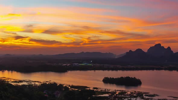 time lapse of beautiful sunset with Khao Jeen Lae mountain and river at Lopburi, Thailand