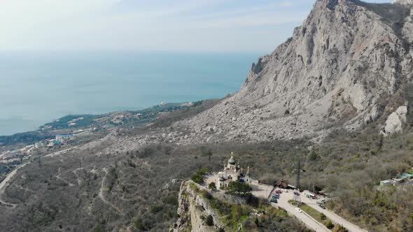 Whitewalled Holy Church with Green Domes on Top of Mountain Crimean Peninsula