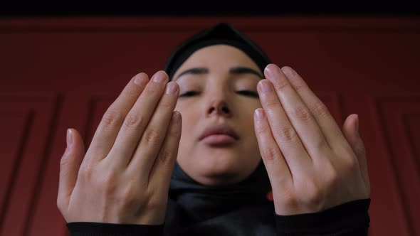 Young Muslim Woman in Hijab Praying Namaz at Ramadan Holiday