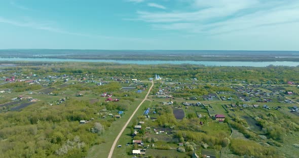Copter is Flying Over the Village a Beautiful Rural View alt