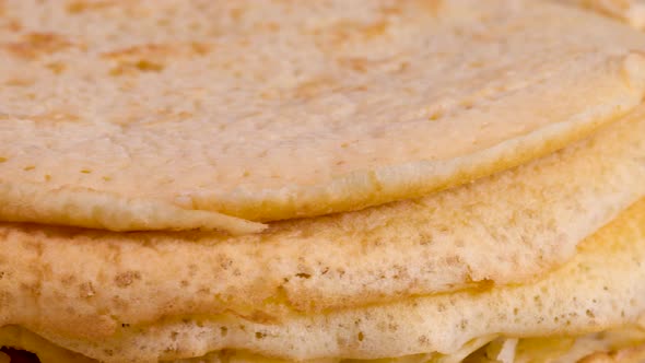 Rotating pile of homemade pancakes, close up view macro shot. Extreme detail. alt