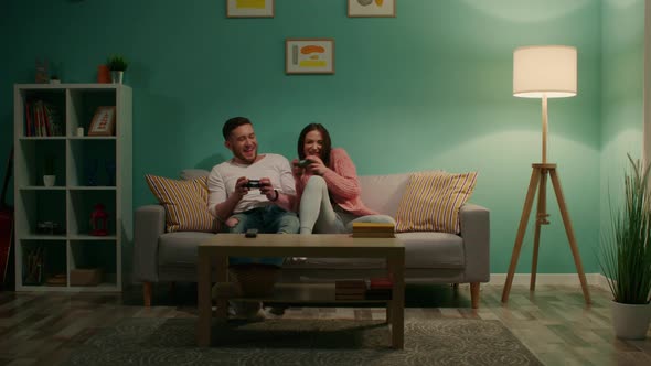 Woman and Man Are Playing Computer Game