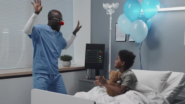 Nurse Entertaining Sick Boy in Hospital alt