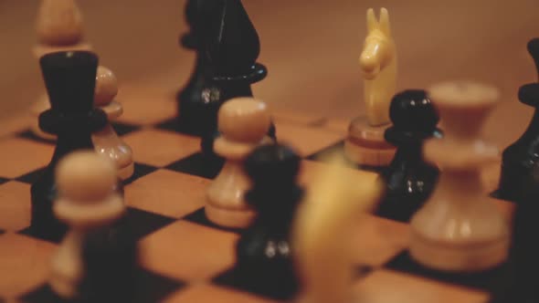 Vintage wooden chess on the chess board