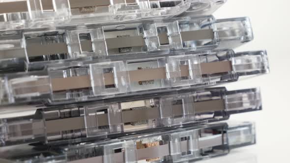 Stack of retro data  analogue magnetic tapes   4K 2160p 30fps UltraHD tilting footage - Close-up of  alt