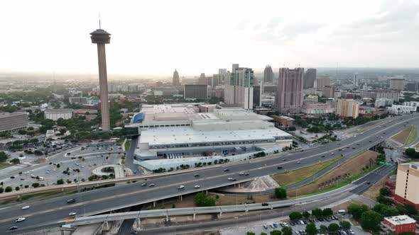 San Antonio skyline at sunset. Tower of the Americas and Convention Center. Aerial by freeway downto alt