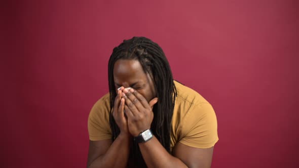 Sick AfricanAmerican Guy Isolated on Red Background alt