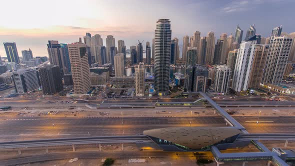 Beautiful Aerial Top View Day to Night Timelapse of Dubai Marina and JLT in Dubai UAE alt