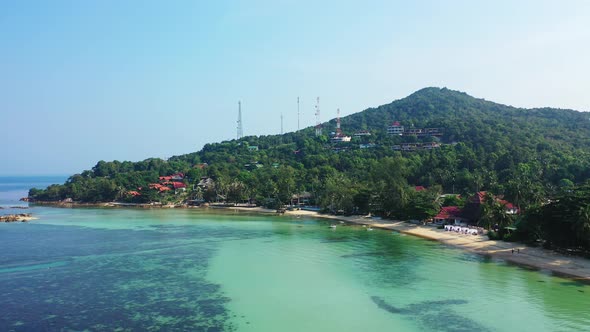 Koh Pha Ngan's west coast sandy Ao Nai Wok Beach and a hill covered ...