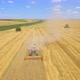 Aerial Shot of Combine Harvester Working in Field - VideoHive Item for Sale