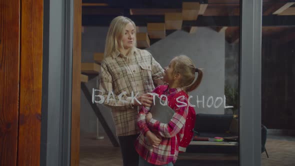 Happy Mom and Schoolgirl Rejoicing Return To Study alt