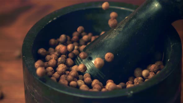 Super Slow Motion in a Mortar with a Pestle Fall Peas of Black Pepper alt