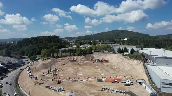 Construction Workers Working on a Building Site of New Residential Building alt