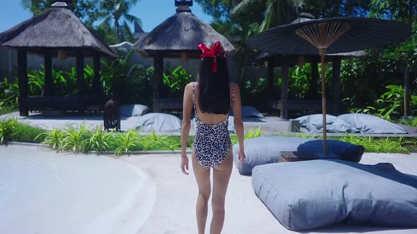 Back View Sexy Girl Swimming Suit Walking Alone In Resort Sunny Day SlowMotion