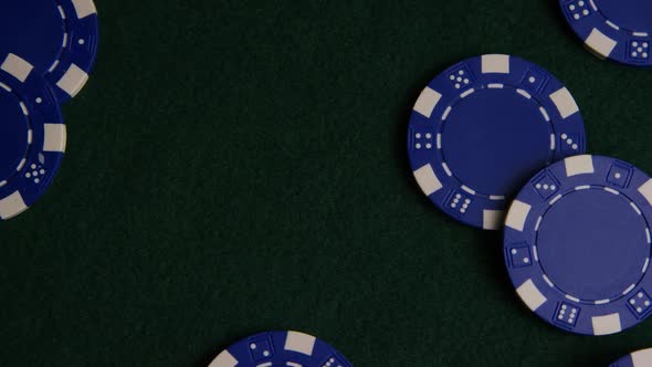 Rotating shot of poker cards and poker chips on a green felt surface - POKER 024 alt