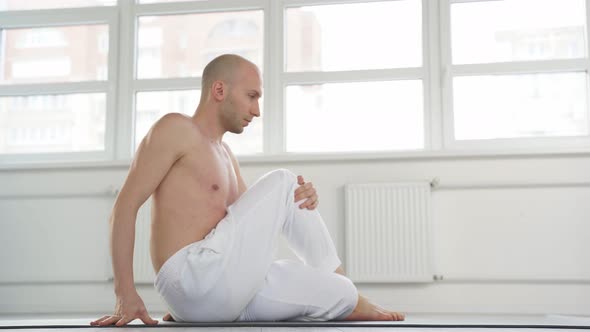 Yogi Male Having Intense Yoga Workout Stretching Body