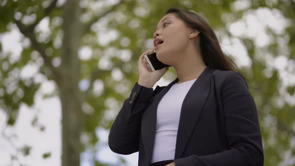 Beautiful Young Woman Talking By Smartphone Outdoor alt