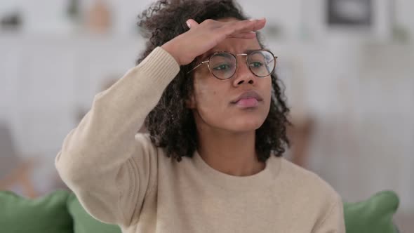 Portrait of Young African Woman Looking Around Searching  alt