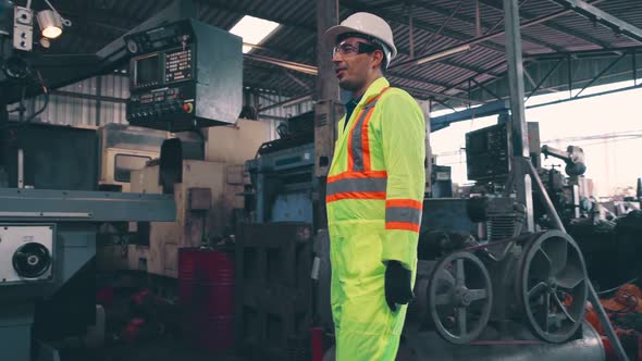 Factory Workers Handshake with Team Member in the Factory alt