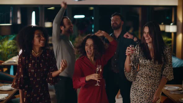 Party Group Dancing Together in Cafe alt