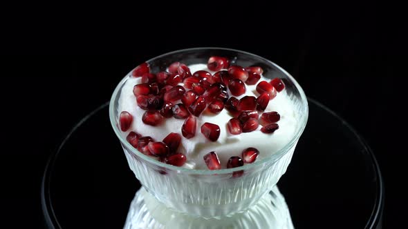 Pomegranate seeds on yogurt