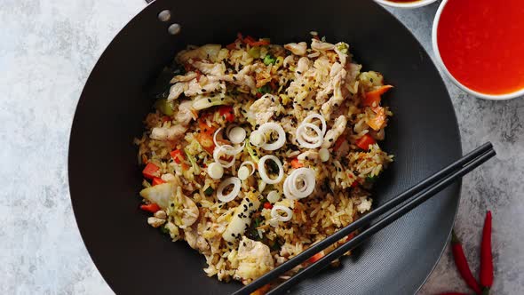 Delicious Fried Rice with Chicken in Wok alt