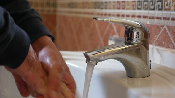 Man Washing Hands with Soap