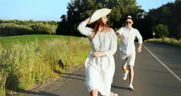 Couple Running on Sunset Countryside Road