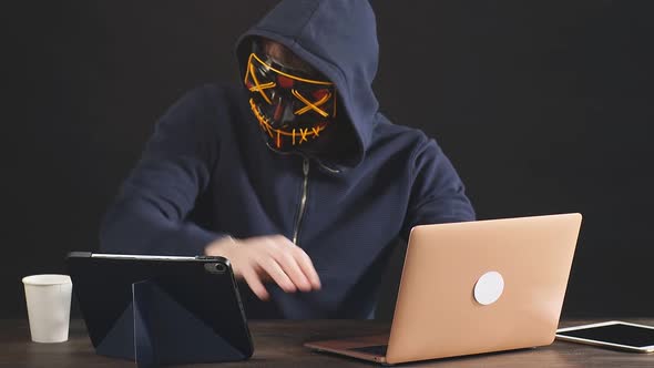 Hacker Man Holding Card in Hand
