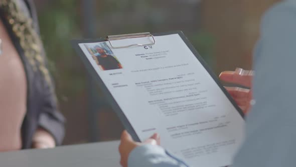 Cheerful Black Businesswoman Talking with Recruiter on Job Interview alt