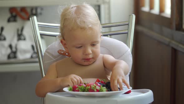 Baby Boy Eating Berries for the First Time 1