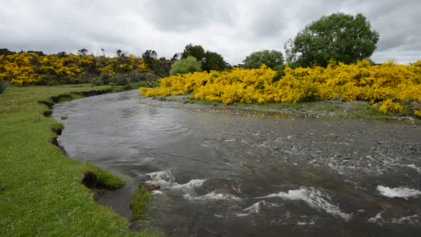 Eglinton River Is Bending Over Grassland Valley Under Depressing Clouds alt