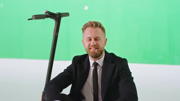 Modern Green Studio Businessman in a Black Suit alt