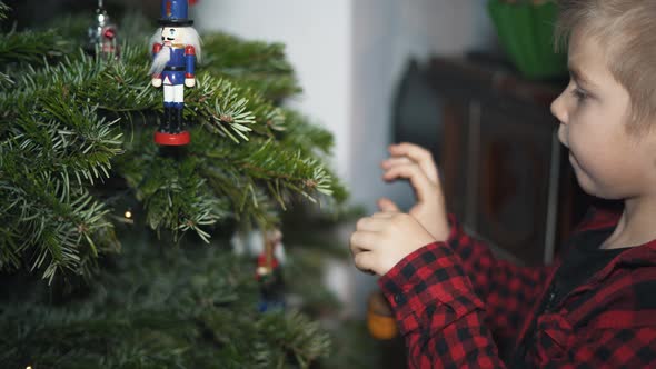Boy Decorated Christmas Tree alt