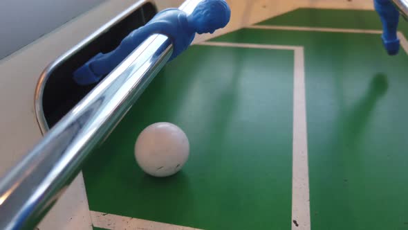 Close up footage of a table football game, also known as foosball alt