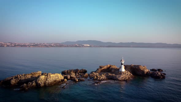 A Beautiful White Lighthouse on a Cliff in the Summer