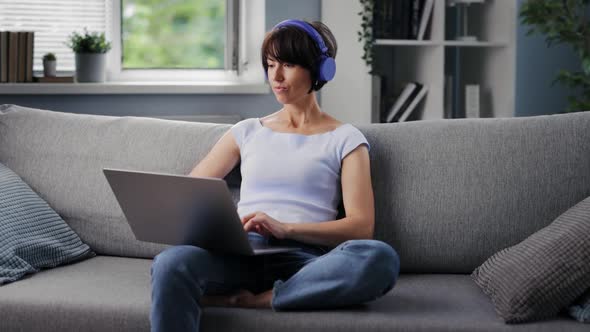 Woman Listening Music in Headphones