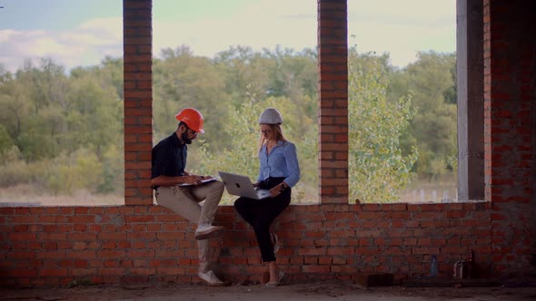 Real Estate Building Project Architect. Builder Constructor Read Blueprints. Two Engineer Builder. alt