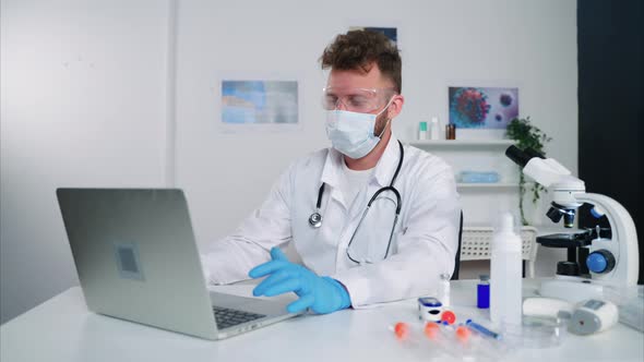 Male Employee of Medical Research Laboratory is Working in Office Filling Test Result in Database alt