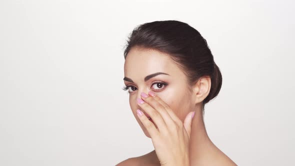 Studio portrait of young and beautiful brunette woman over alt