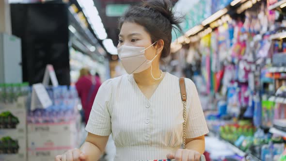 shopping in covid spread,asian female adult woman wearing face mask protection