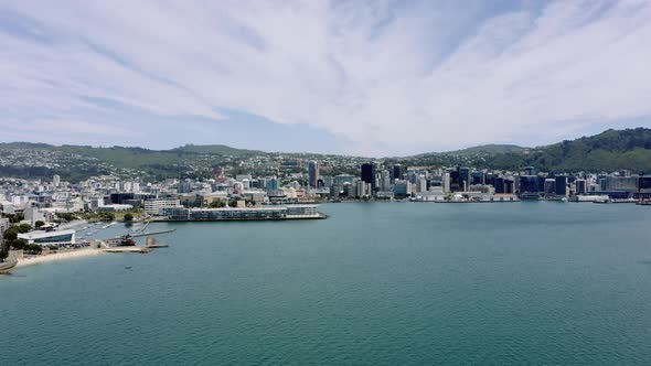Aerial of Wellington city and Harbour during a lovely sunny day in New Zealand with a beautiful clou alt