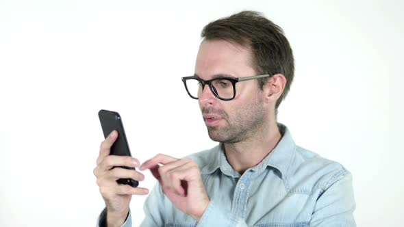 Man Reacting to Loss and Using Smartphone White Background alt