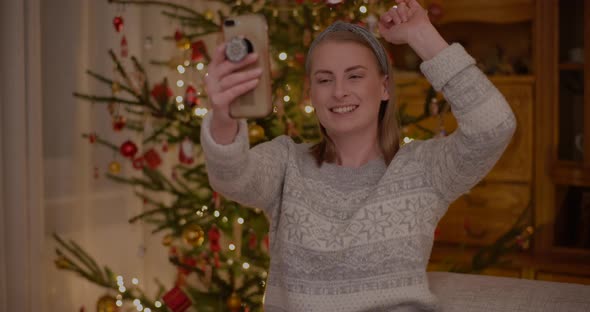 Woman Doing Videocall or Videochat Video Chatting Christmas Smartphone alt