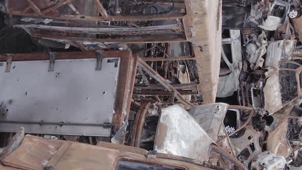 Vertical Video of Wartorn Cars in Ukraine alt