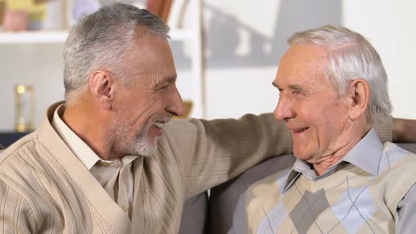 Elderly Male Friends Talking and Hugging, Meeting Brothers, Holiday Greeting alt