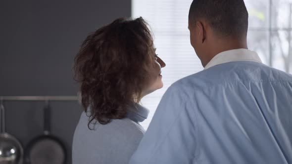 Happy Loving Caucasian Woman Hugging African American Man Putting Head on Shoulder alt