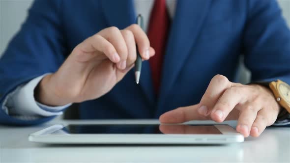 Close Up Of Businessman Working In Office And Using Digital Tablet