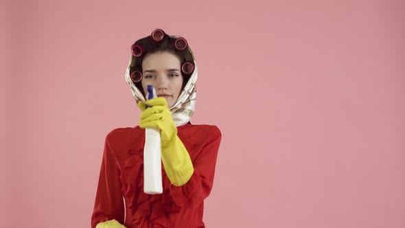 A Woman in a Red Blouse Washes an Invisible Window with a Special Hair Brush